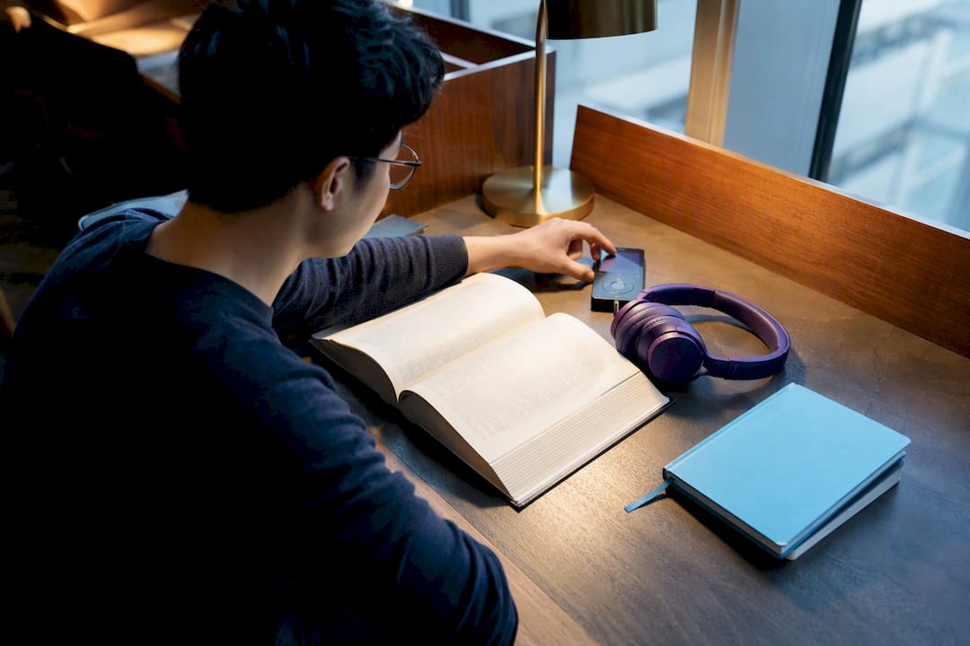 Student preparing music for focused study