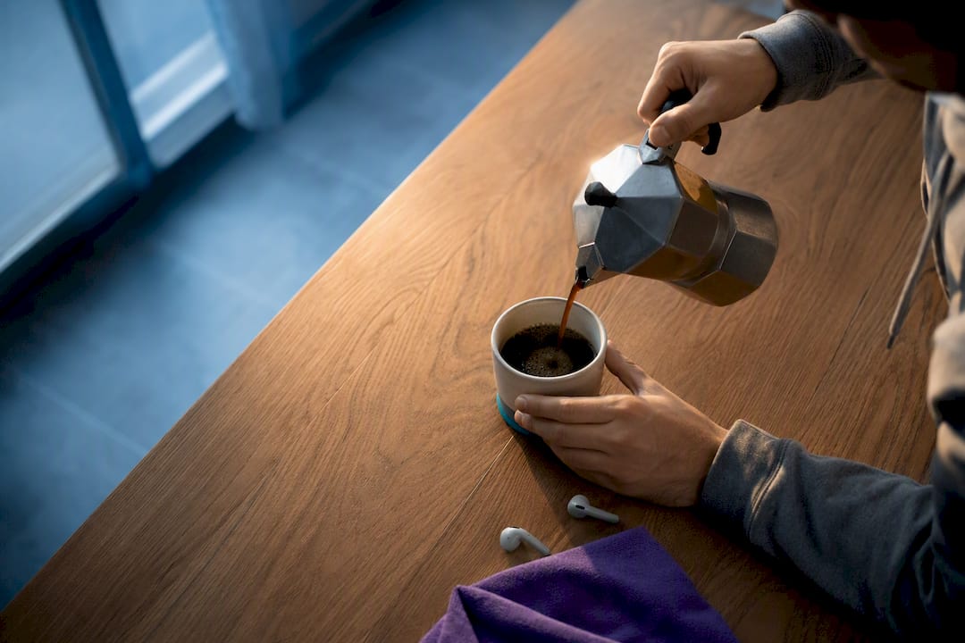 Morning coffee ritual with music listening cues