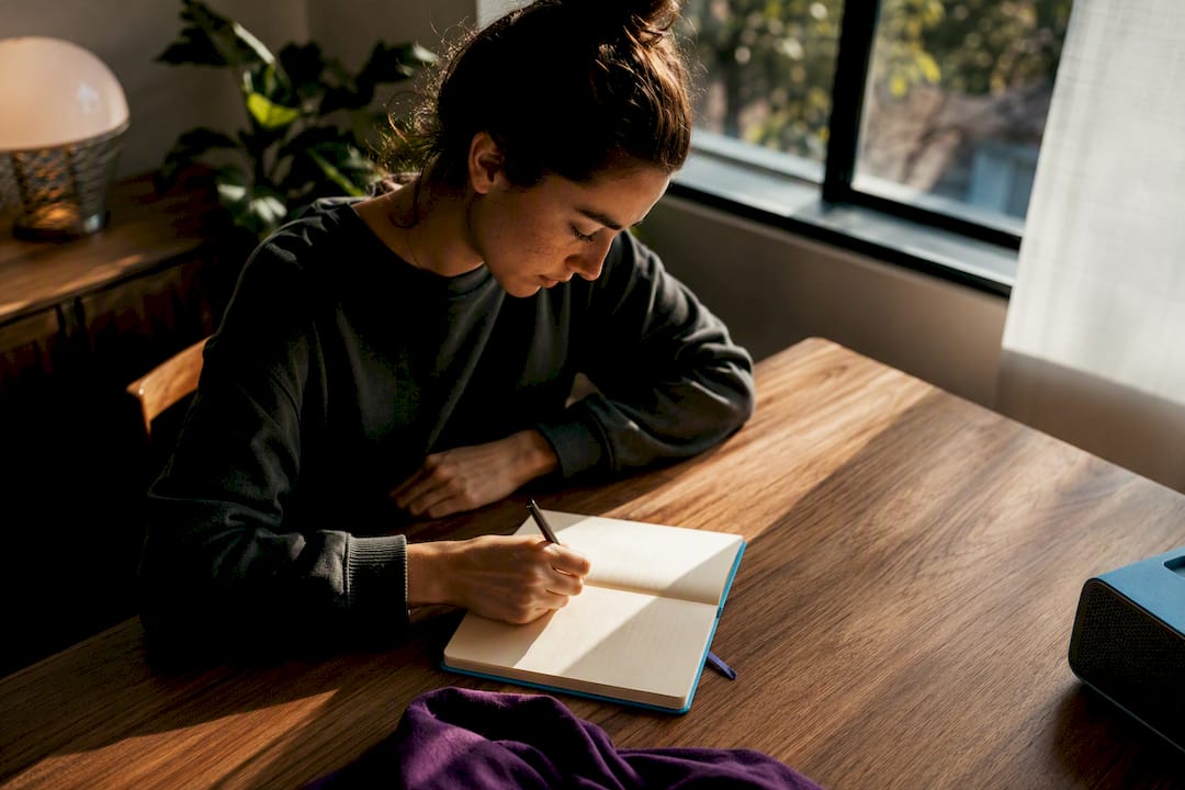 Person journaling during a resilience routine