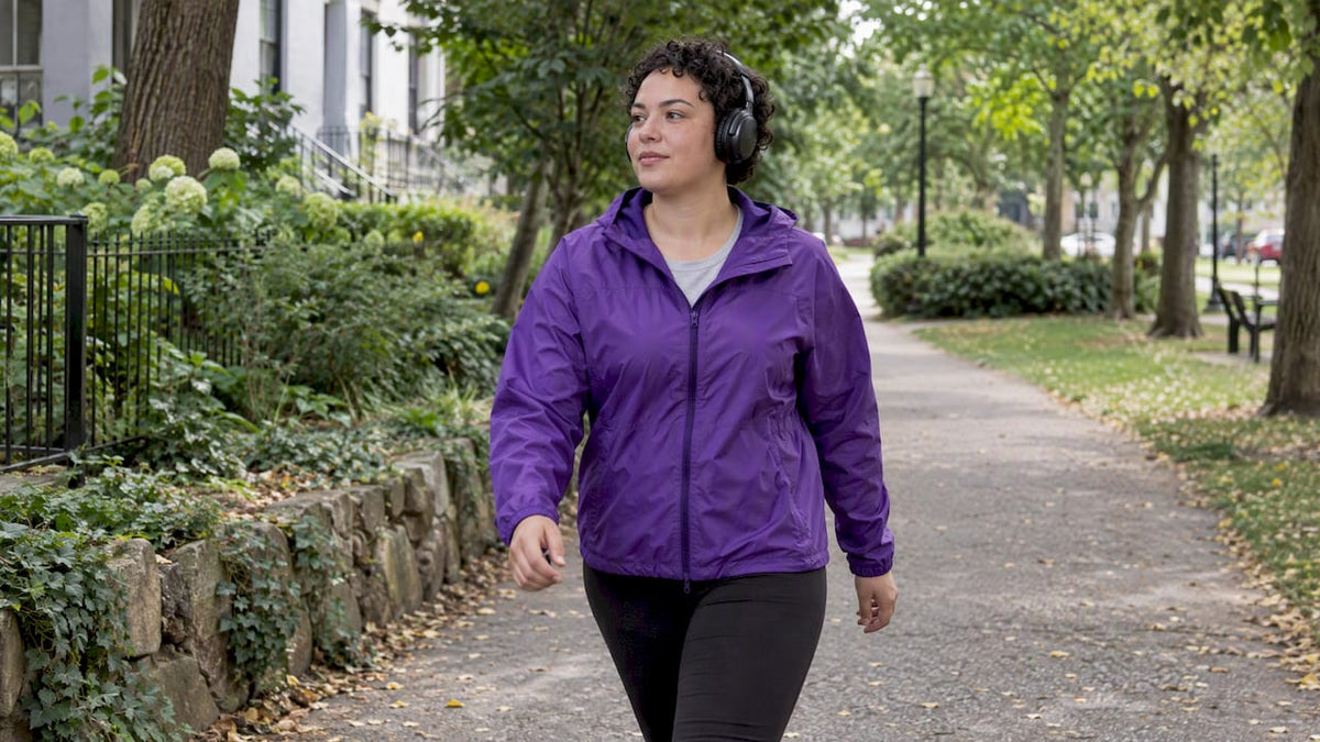 Listener enjoying an upbeat song outdoors