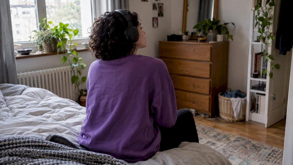 Woman listening to a song at home