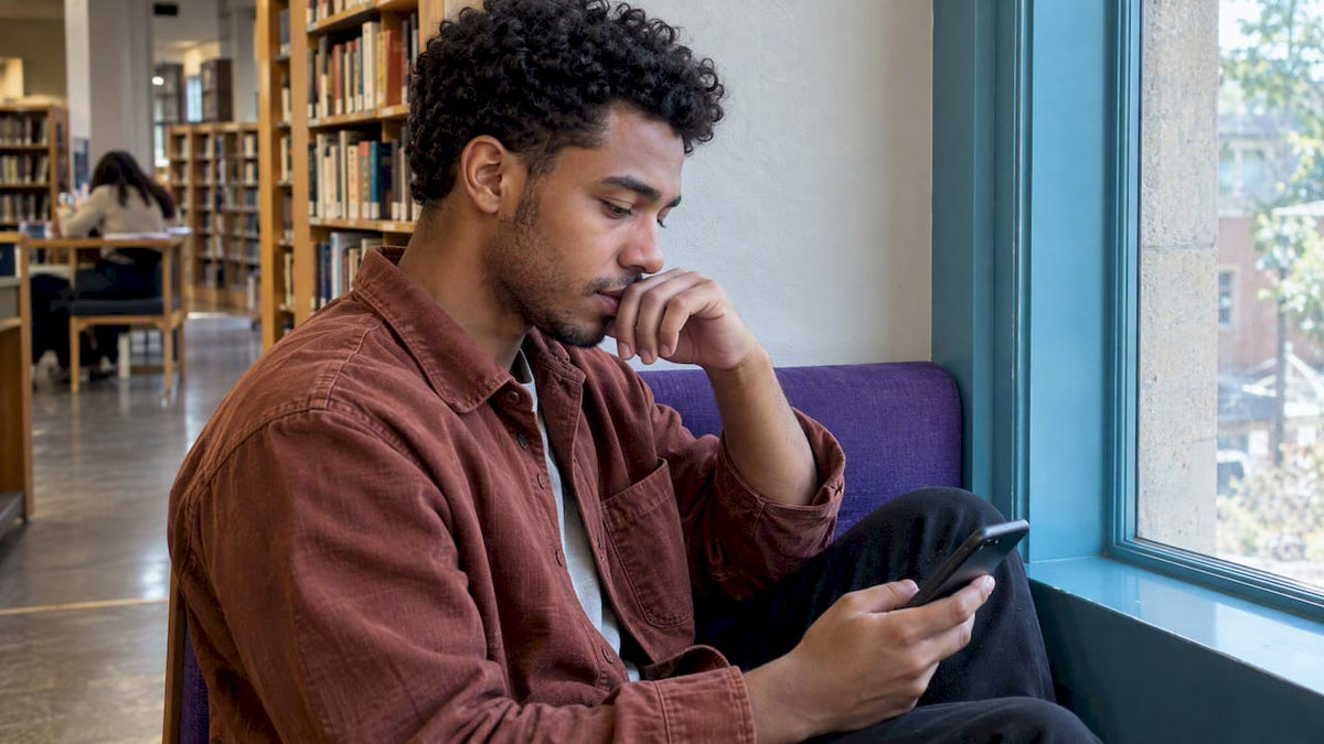 Man pausing before interpreting an unanswered message