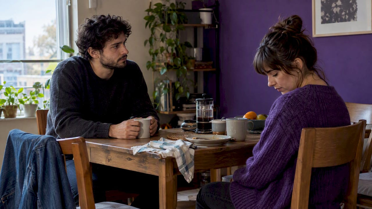 Partners sitting in silence during a difficult conversation