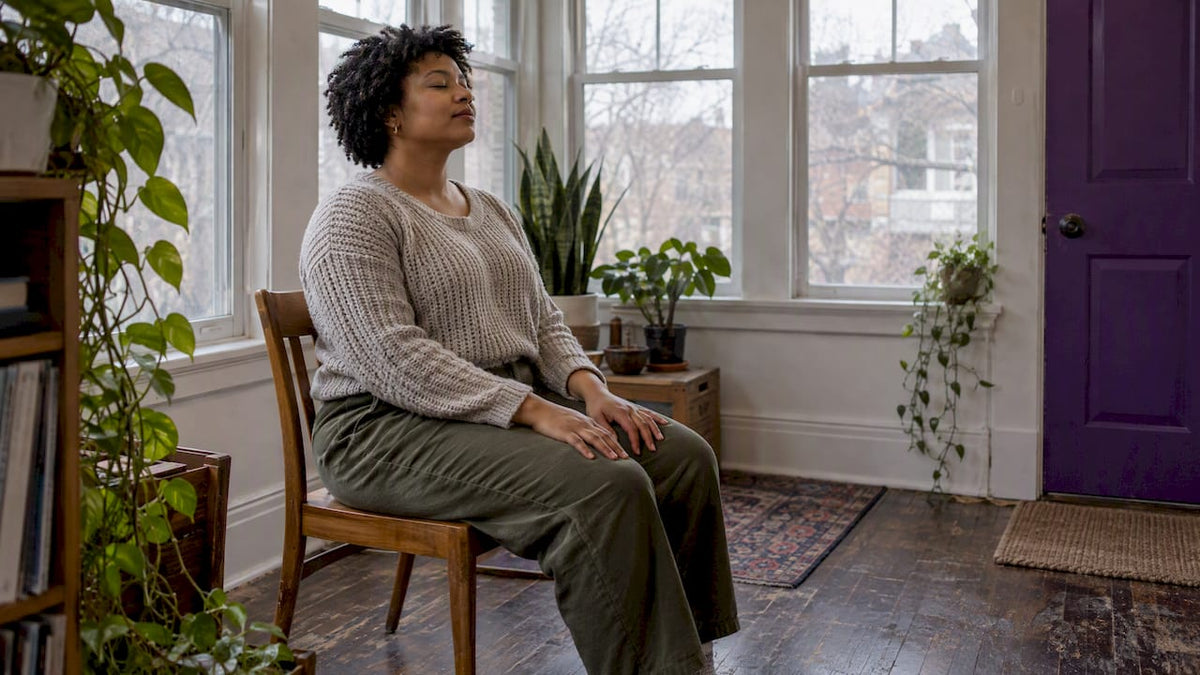 Woman pausing quietly for self-compassion